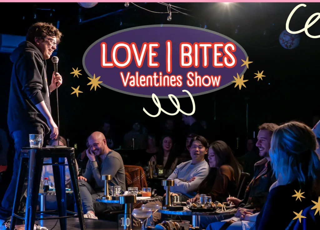 A graphic for the Love Bites Valentines Show on valentines day at the Denver Comedy Lounge. Patrons at the club eat and laugh as a male comedian in a black hoopie cracks jokes.